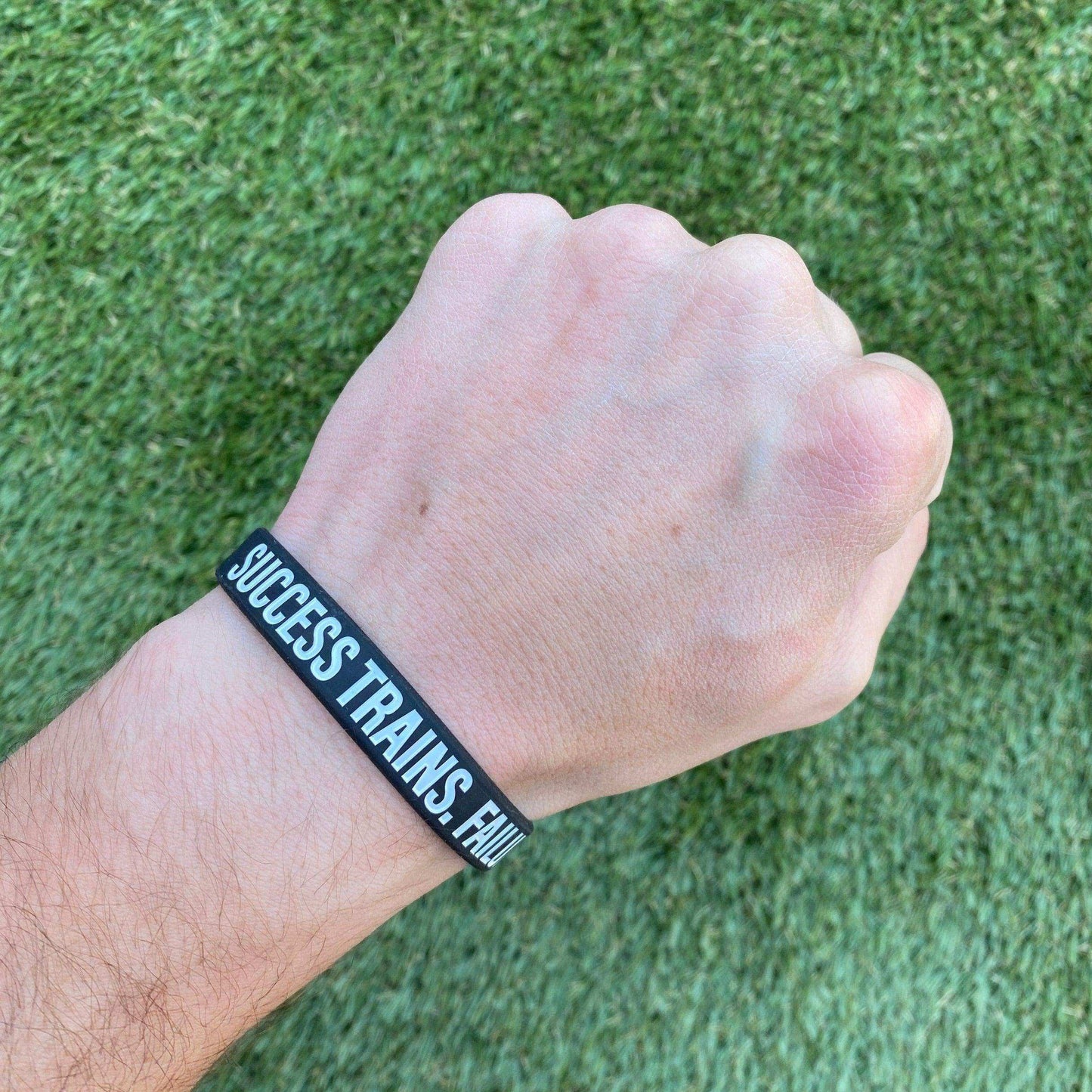 SUCCESS TRAINS. FAILURE COMPLAINS. Wristband - Skoutley Outdoors LLC